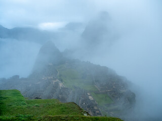 Early morning before the crowds arrive and before the clouds completely clear at Machu Picchu.