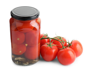 Tasty pickled tomatoes in jar and vegetable isolated on white