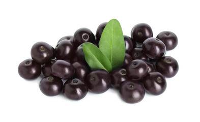 Fresh ripe acai berries and green leaves isolated on white