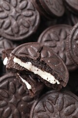 Tasty sandwich cookies as background, closeup view