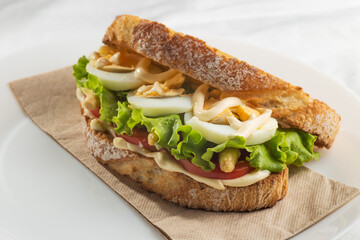 Vegetable sandwich with tomato, lettuce, asparagus, egg and mayonnaise.