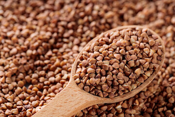 Wooden Spoon with Raw Buckwheat, Close-Up