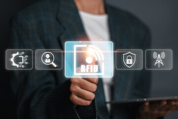 A businessman using RFID technology for efficient data management and enhanced security in a modern business environment.