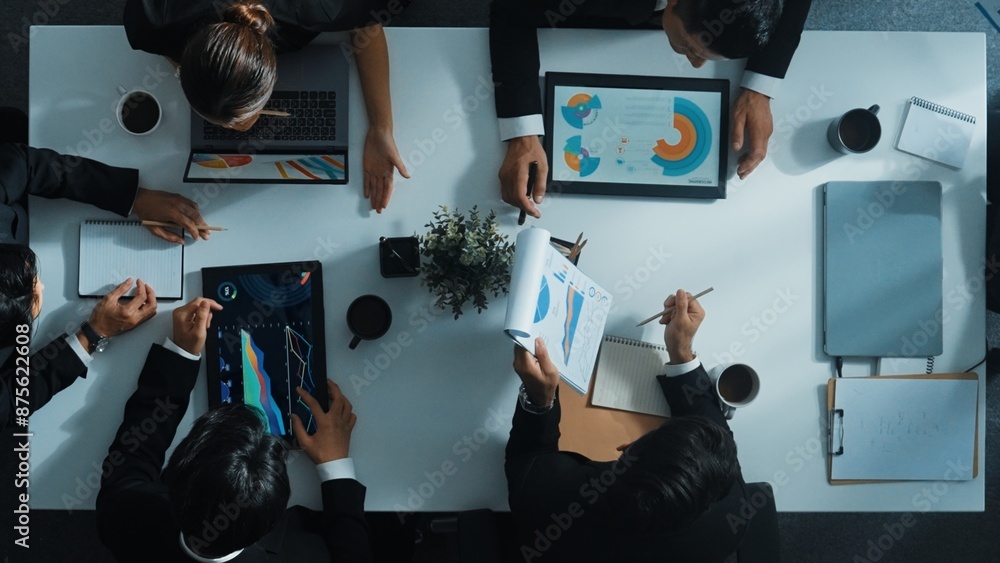 Aufkleber top down aerial view of smart manager pointing at financial graph on whiteboard while diverse busine