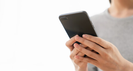 Woman holding a smartphone and using social media on internet.