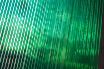 The clear glass sheets are meticulously stacked, creating a modern and elegant look