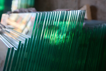 The clear glass sheets are meticulously stacked, creating a modern and elegant look