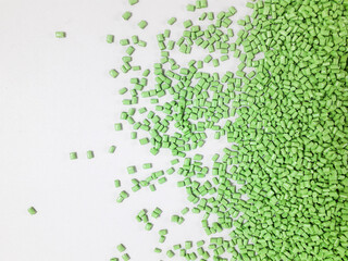 Matcha green masterbatch granules on white background.Color pigment carrier polymer in plastic industry