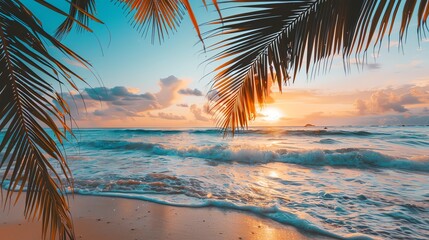 Amazing  sunset over the ocean with palm trees in the foreground.