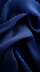 Fototapeta premium an image of a dark blue fabric on a black background