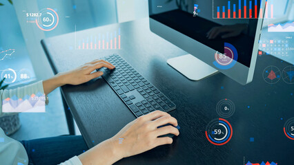 A woman using computer in office and statistics data concept.