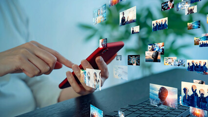 A woman using computer and smart phone in office and digital contents concept.