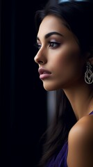 Fototapeta premium portrait of beautiful woman in purple dress looking out of window