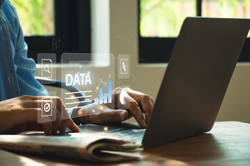 Data Management Systems, Businessman using laptop with data analysis.