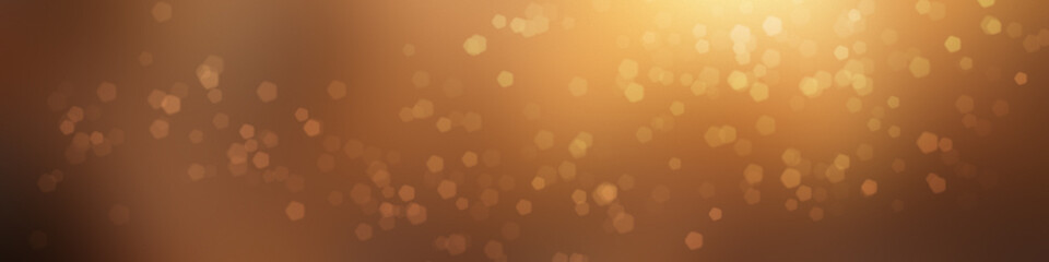 A bokeh blur background in yellow, gold, and orange. 