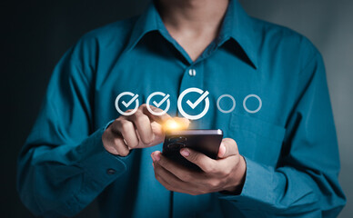 Businessman doing checklist online on smartphone. online checklist survey, take an assessment, questionnaire, evaluation, online survey, online exam.