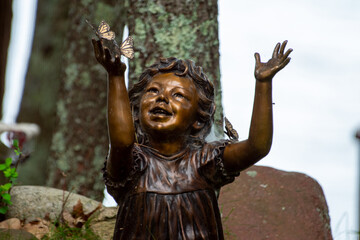 Bronze Statue of a Little Girl Playing with Butterflies