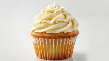 Tasty vanilla cupcake with cream frosting isolated on a white background