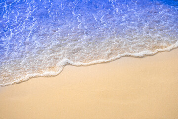 Top view of background for summer vacation concept. Nature of the beach and sea, summer with sunlight, sandy beach The sparkling sea water	