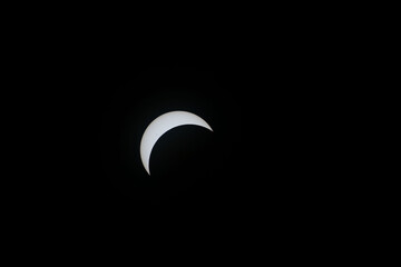 Total eclipse waxing as moon begins to cover the sun