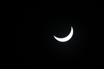 Total eclipse waning as moon begins to uncover the sun