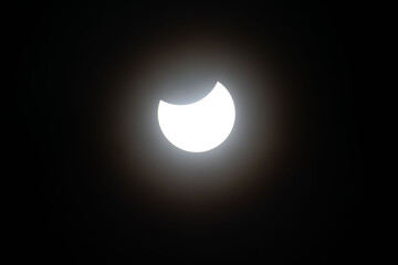 Total eclipse waning as moon begins to uncover the sun