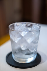 A glass of ice on the table