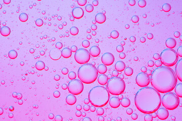 Abstract background of purple bubbles of oil in liquid