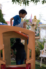 Kids friend group enjoying climb and run on playground park