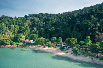 Beautiful morning view coastline tropical beach Koh Chang with scenery bungalow near crystal clear ocean water. Summer holidays in tropical paradise