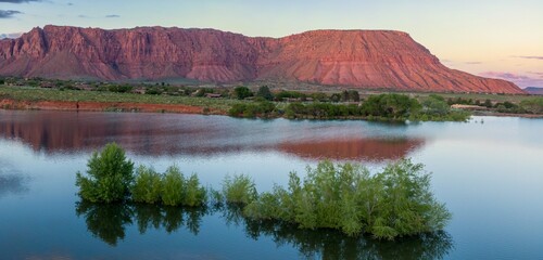 Ivins Reservoir and mountain range at sunset, Ivins, Utah, United States of America.