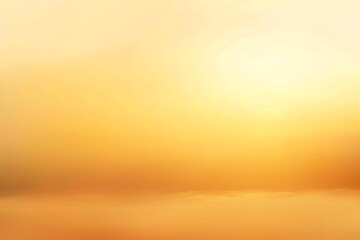 Obraz premium Golden sunrise with soft clouds inducing a warm, serene atmosphere in the sky.