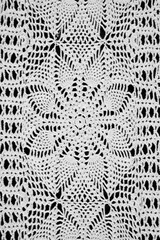 Abstract Grandmas Doily, close up on a black background in black and white