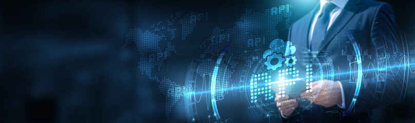 Businessman using tablet on global network connection on API and cloud services with real-time data and development of applications. Technology and innovation drive growth and efficiency.