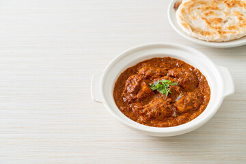 chicken tikka masala spicy curry meat food with roti or naan bread