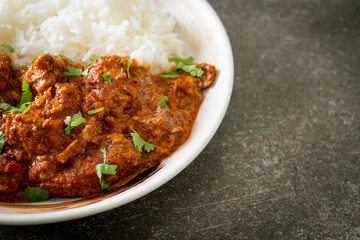 chicken tikka masala with rice on plate