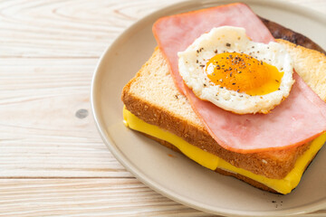 bread toasted cheese topped ham and fried egg with pork sausage