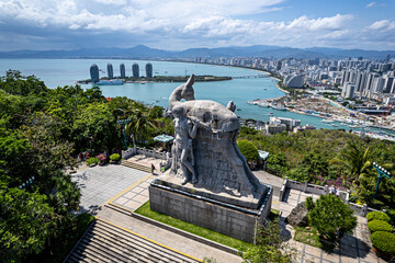 China Hainan island, Sanya city symbol, girl and the deer turning his head top view from above