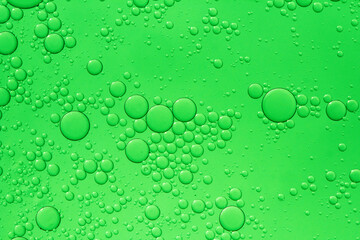 Abstract background of water drops green bubbles of oil in liquid