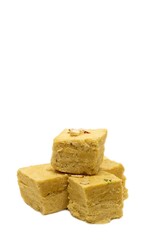 Soan Papdi or Shompapri Garnished with Cashew Nut and Saffron Isolate on White Background with Copy Space, Also Known as Patisa or Shonpapdi
