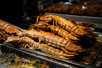 crayfish or mantis shrimp grilled in chinese market ,seafood background , seafood