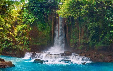 Sumampan waterfall Bali one of the most majestic waterfalls Bali hidden in tropical rainforest jungle Ubud, Bali Indonesia