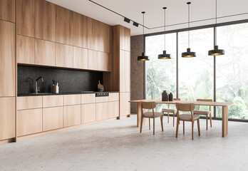 Home kitchen interior with dinner table and cooking cabinet. Panoramic window
