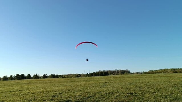 Flight on paraglider on a sunny summer day