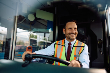 Happy bus driver driving  bus.