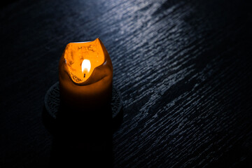 candle fire darkness indoor table wooden surface texture narrow focus concept picture background...
