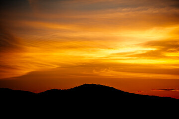 evening view of mountains covered with forest, beautiful sunset