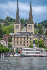 Fototapeta premium amazing beautiful city where tourist can see architecture old town city cow , river cruising wooden bridge at Lucerne Switzerland 