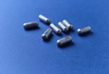 BCAA amino acids. Nutrition for bodybuilding. Fitness supplements on dark background. Soft focus. Copy space.	