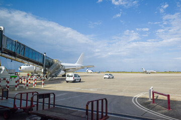 Fototapeta premium Planes preparing for take off on the runway at an airport